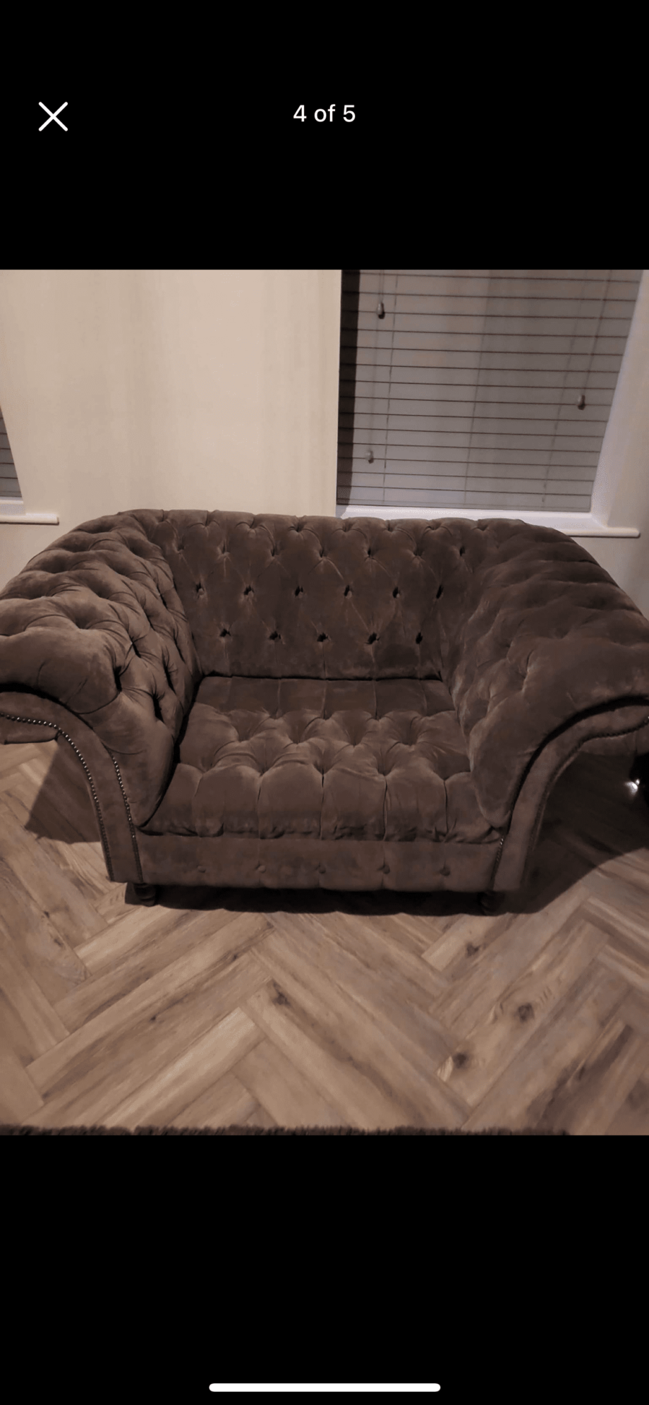 Grey Chesterfield sofa chair with pouffe