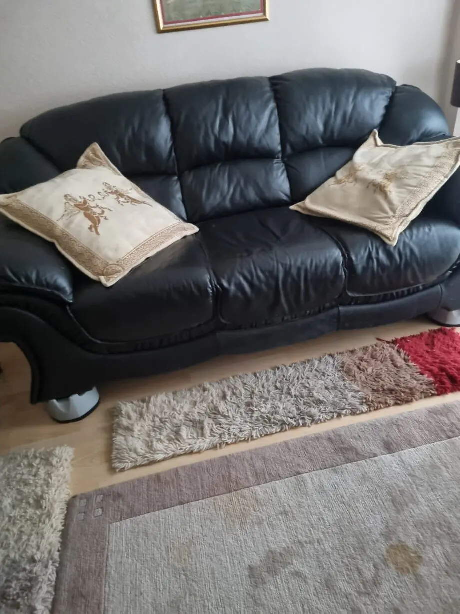 Black leather sofas, lovely condition