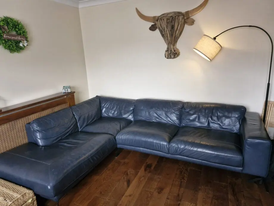 DFS navy leather corner sofa and chair