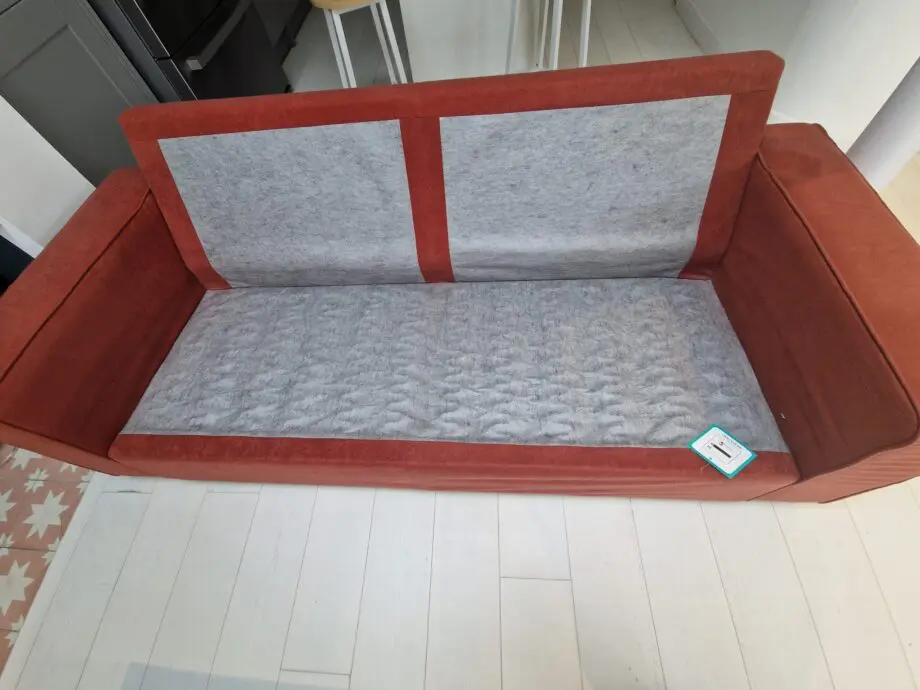 Two lovely matching comfy rust/orange sofas
