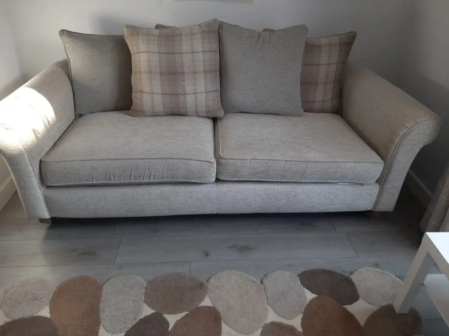 DFS 3 SEATER BEIGE OATMEAL SOFA AND FOOTSTOOL