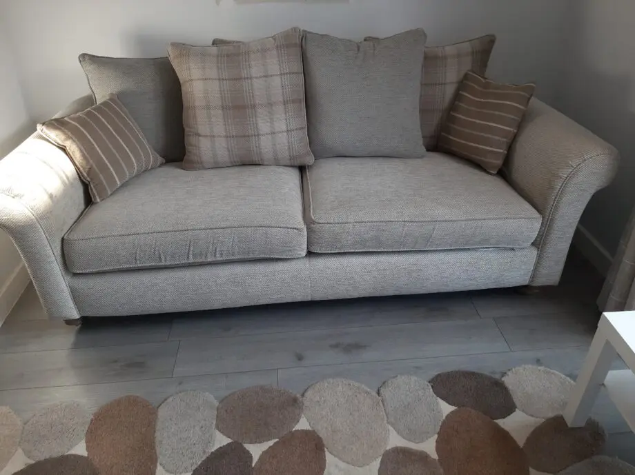 DFS 3 SEATER BEIGE OATMEAL SOFA AND FOOTSTOOL